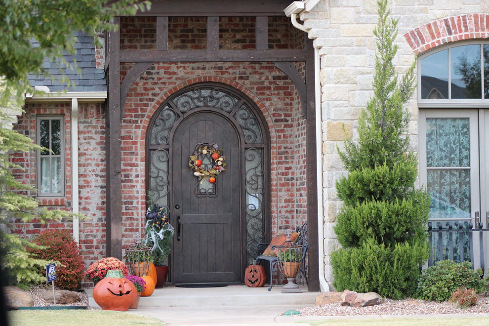 Medium sized traditional front door in Oklahoma City with a single front door and a metal front door.