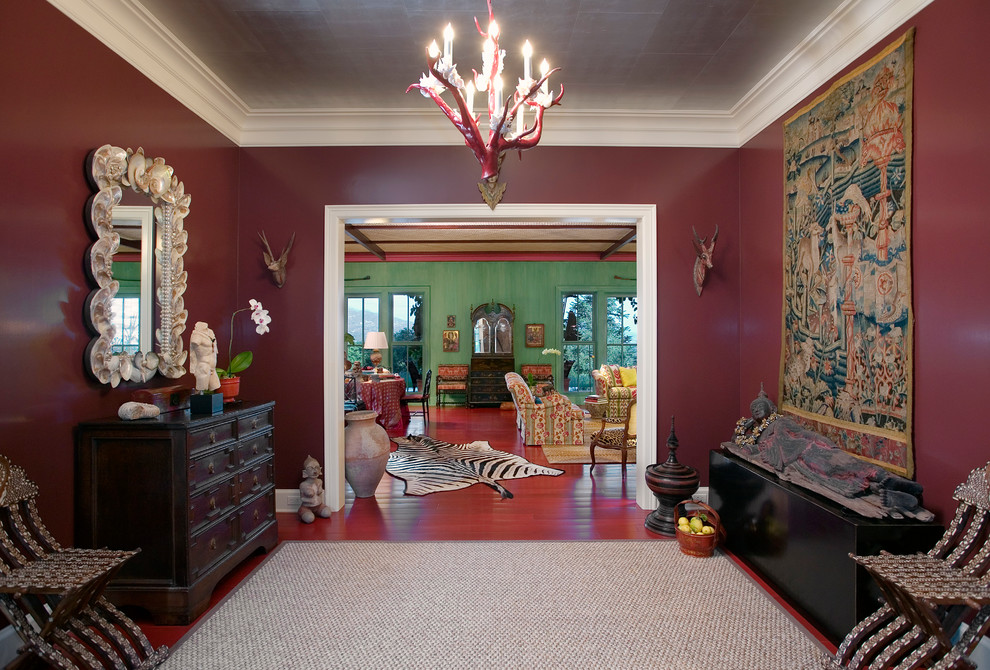 Design ideas for an eclectic foyer in Santa Barbara with red walls.