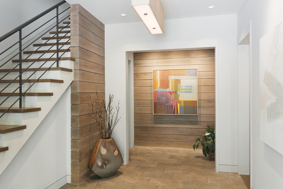 Inspiration for a contemporary entry hall remodel in Other with white walls