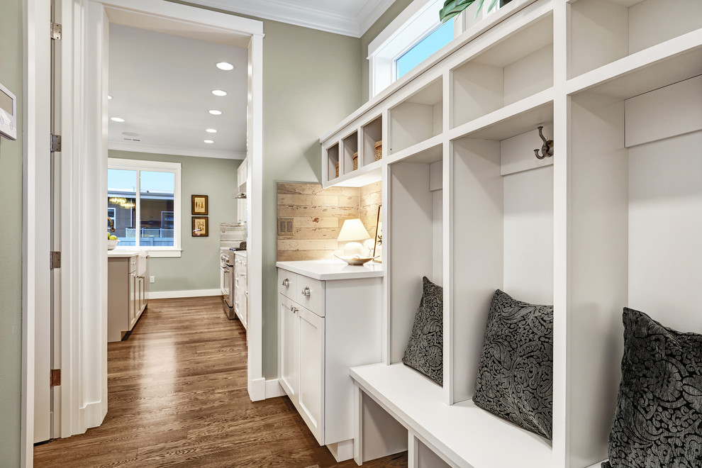 Design ideas for a classic boot room in Seattle with beige walls and light hardwood flooring.