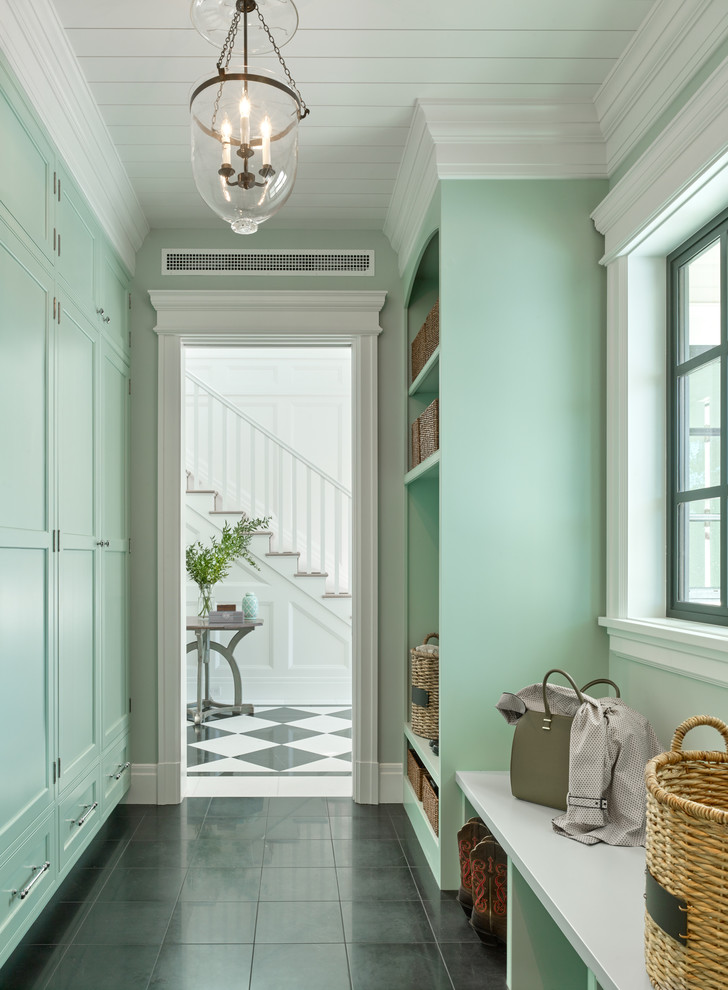 Inspiration for a timeless marble floor mudroom remodel in San Francisco with green walls