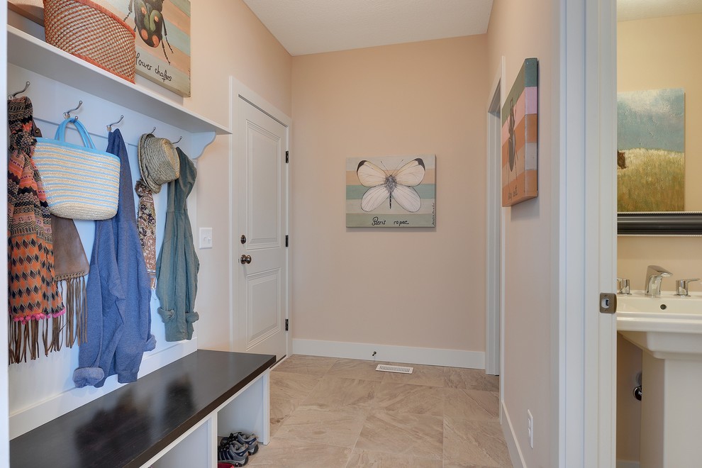 Example of a large transitional porcelain tile entryway design in Minneapolis with pink walls and a white front door