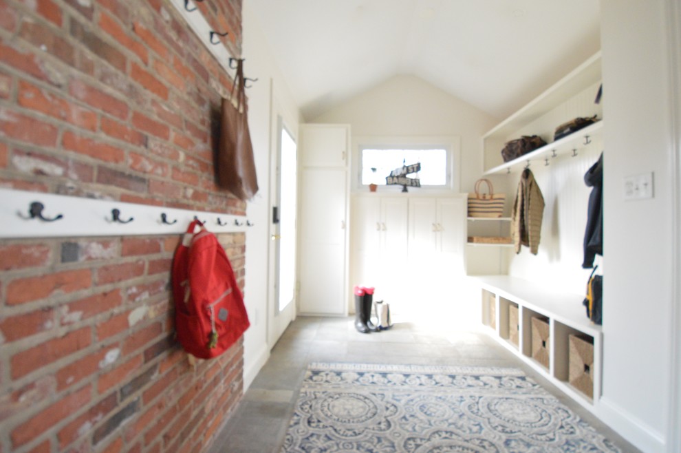 This is an example of a small traditional entrance in Bridgeport with white walls, slate flooring and blue floors.