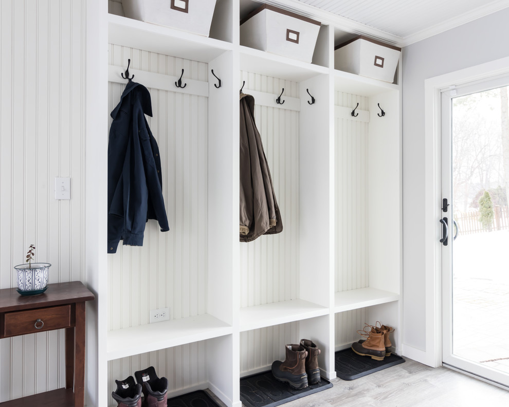 Medium sized classic boot room in Other with grey walls, laminate floors, a single front door, a white front door and grey floors.