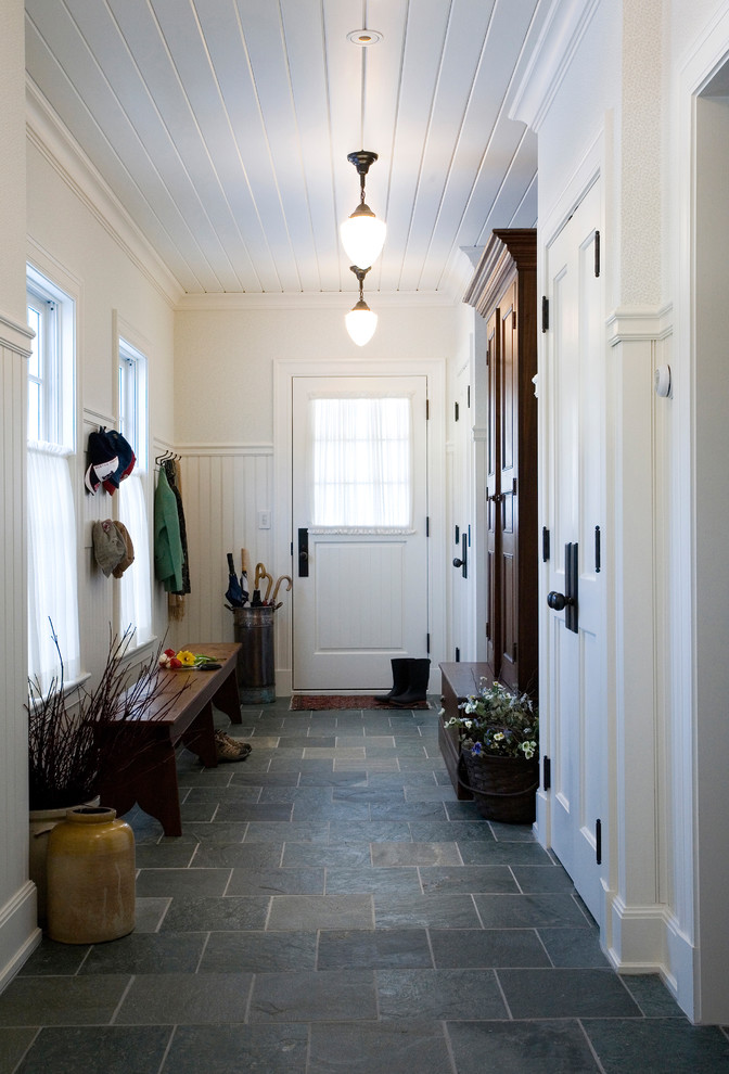 Elegant slate floor and gray floor mudroom photo in Boston