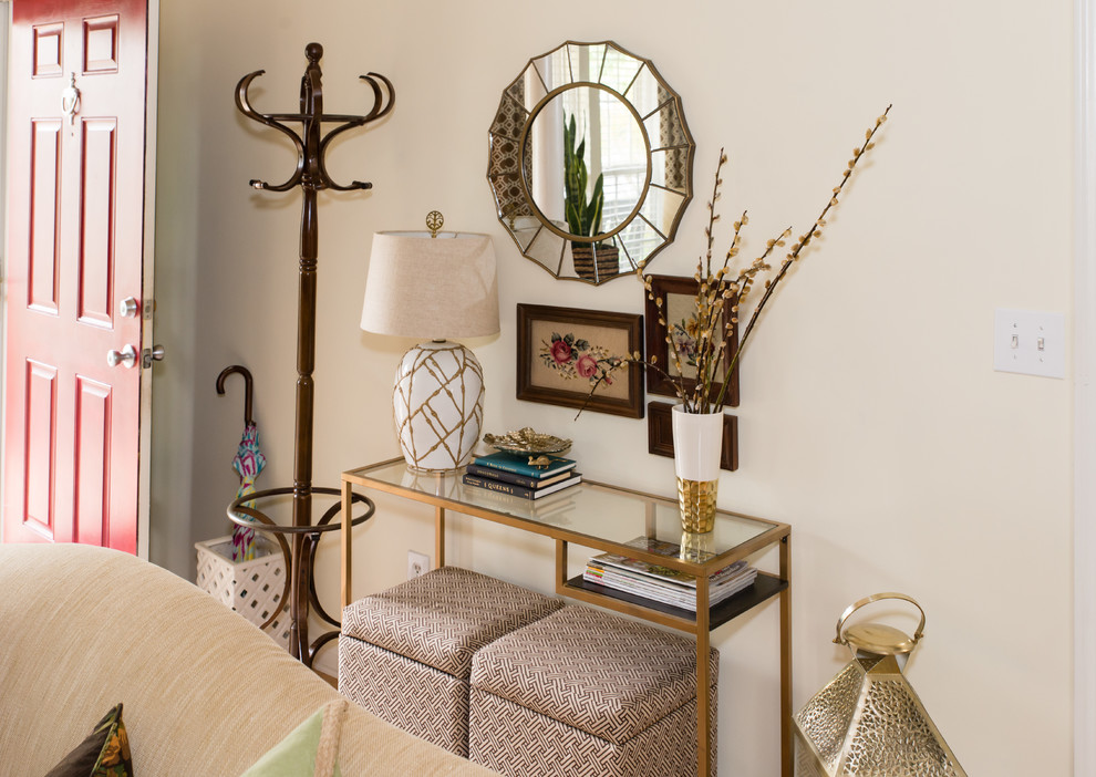 Entryway - small transitional entryway idea in Charlotte with beige walls and a red front door