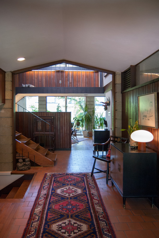 Inspiration for a retro entrance in Philadelphia with terracotta flooring and feature lighting.