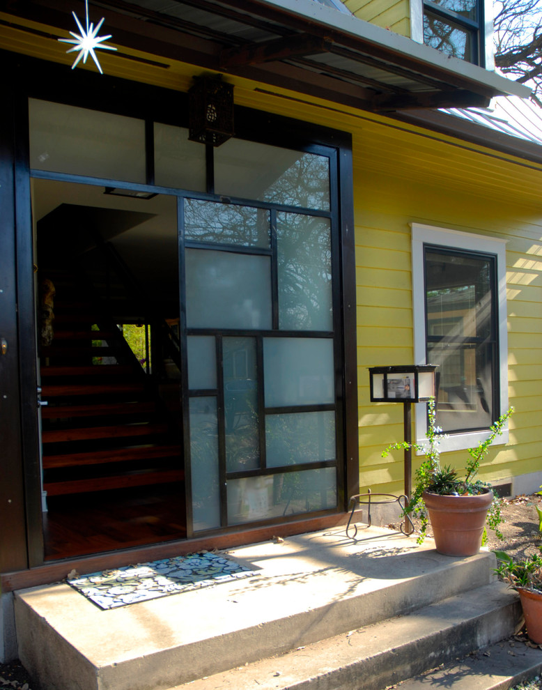 Contemporary entrance in Austin with a glass front door.