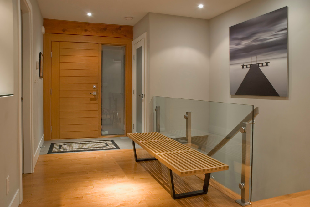 Example of a trendy entryway design in Vancouver with beige walls