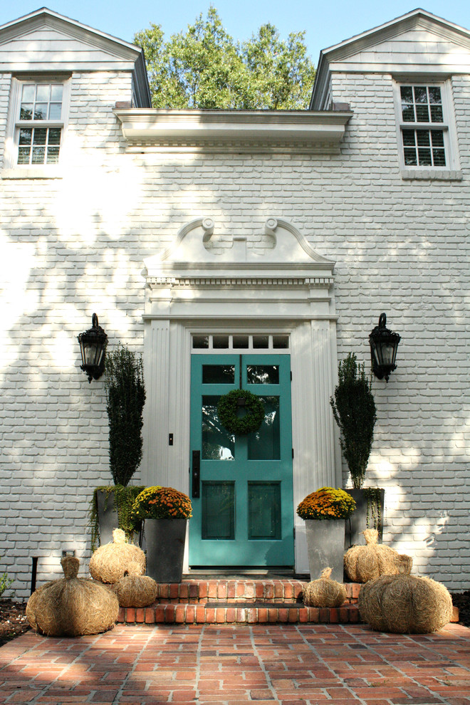 Inspiration for a timeless entryway remodel in Tampa with white walls