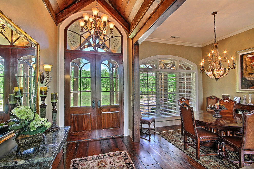 Inspiration for a large craftsman dark wood floor entryway remodel in Atlanta with beige walls and a dark wood front door