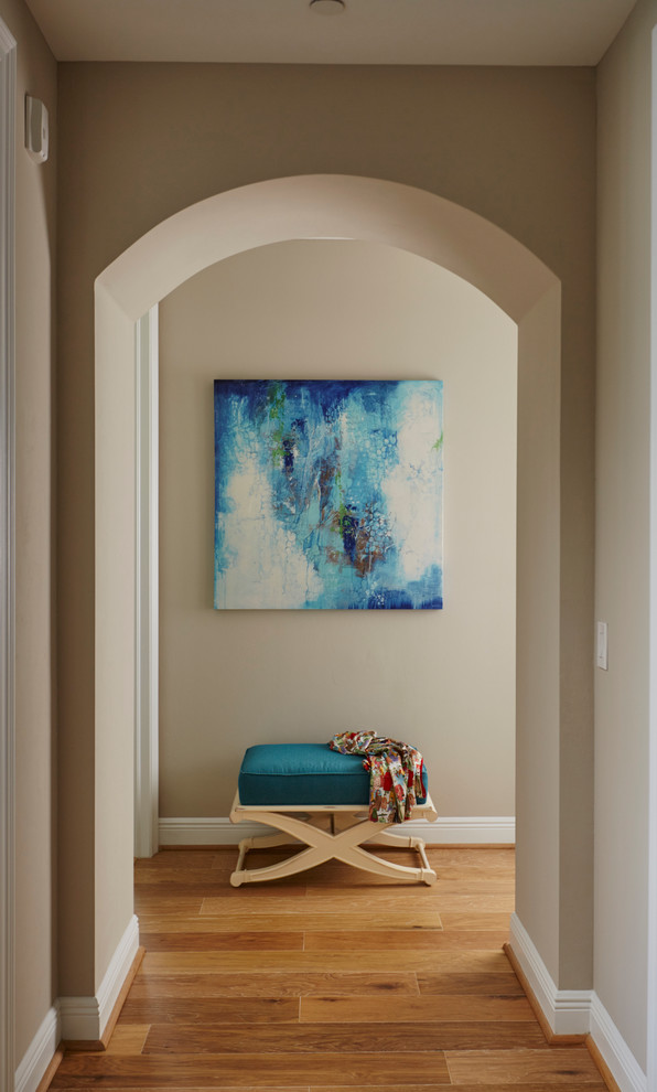 Entryway - mid-sized transitional medium tone wood floor entryway idea in Miami with blue walls and a white front door