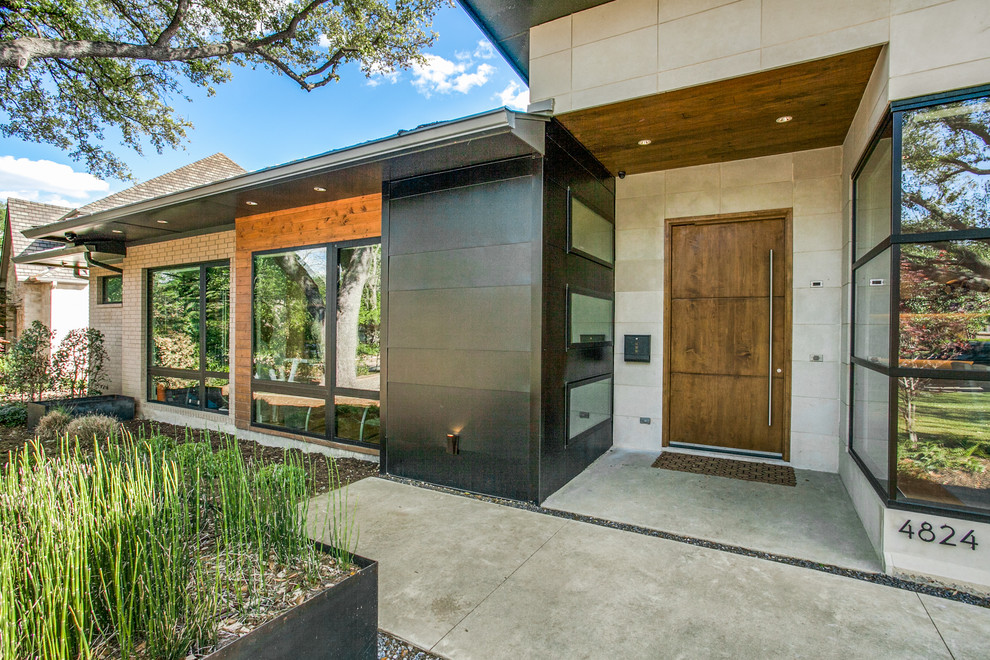 Entryway - contemporary entryway idea in Dallas with a dark wood front door
