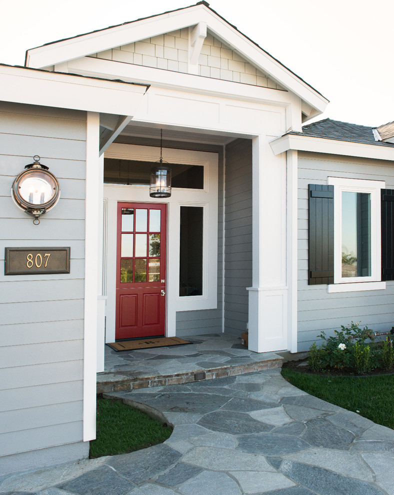 Entryway - traditional entryway idea in Orange County with a glass front door