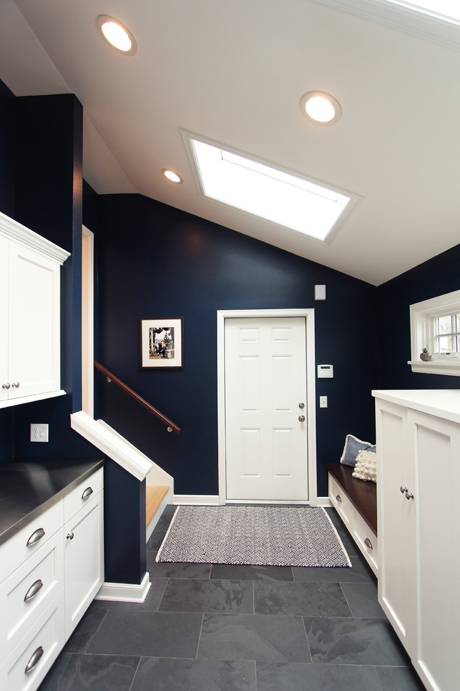 Navy Blue Mudroom off Kitchen with Coat Closets and Bench