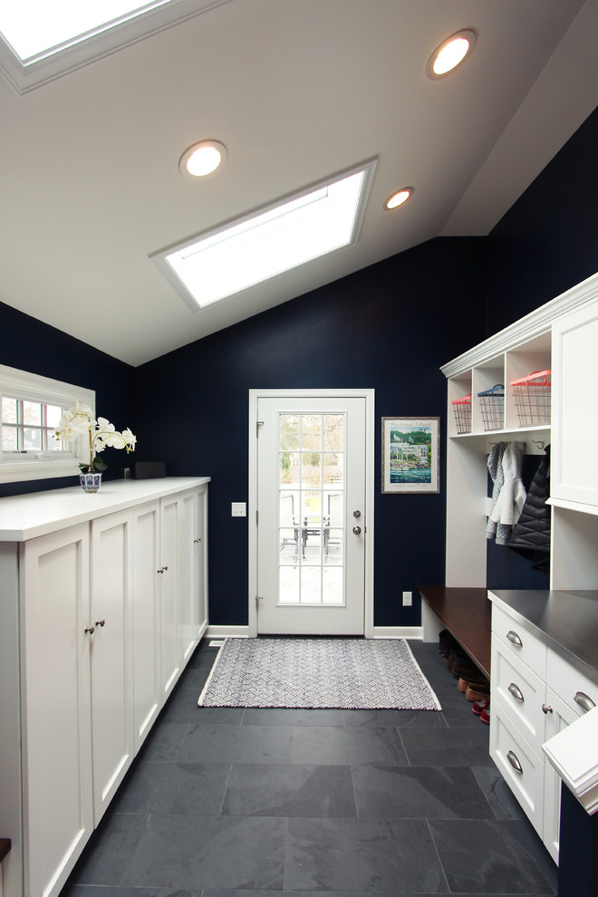 Large transitional slate floor and gray floor entryway photo in Other with blue walls and a white front door