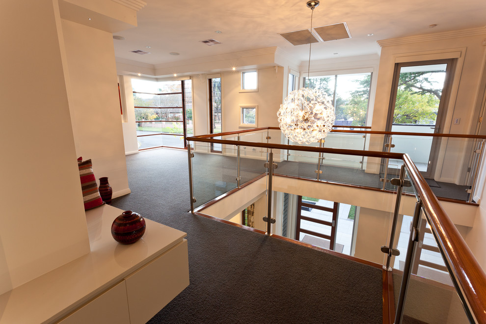 Photo of a medium sized contemporary foyer in Sydney with white walls.