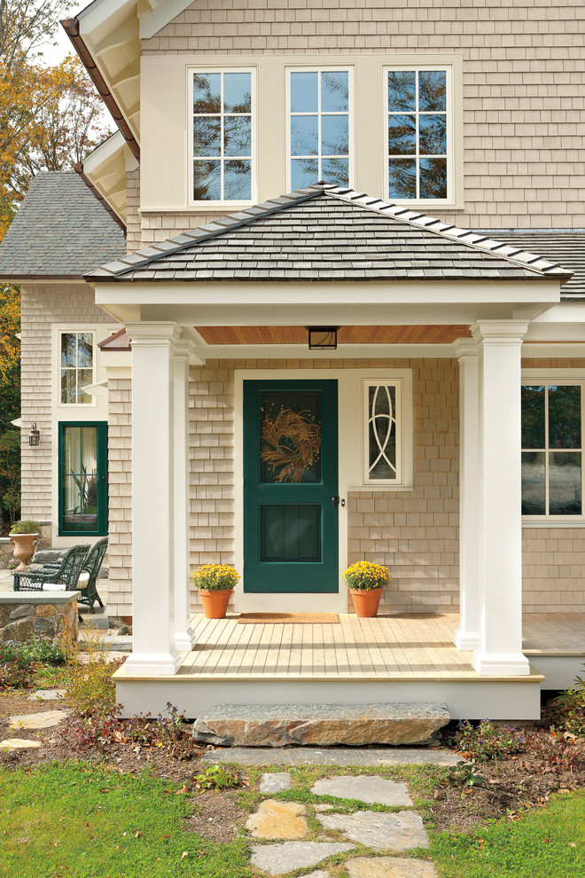 This is an example of a classic front door in New York with a single front door and a green front door.