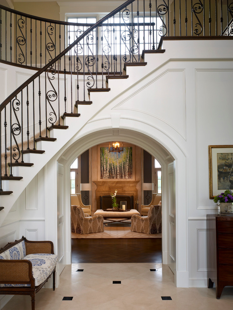 This is an example of a traditional foyer in Columbus with white walls.