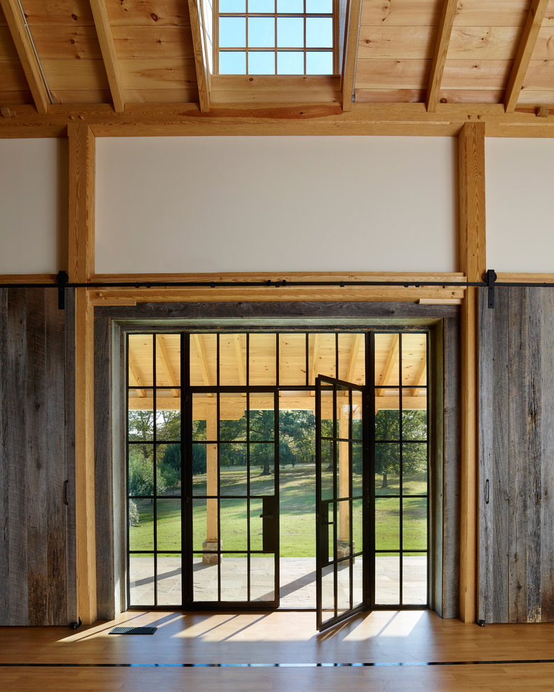 This is an example of an expansive rural front door in Philadelphia with a double front door and a black front door.