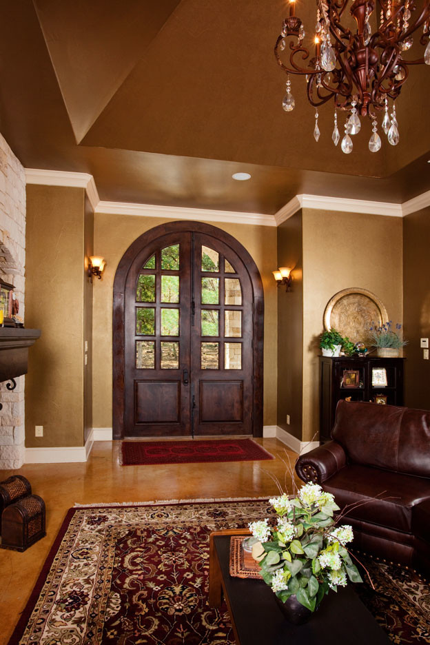 Inspiration for a timeless entryway remodel in Austin with metallic walls and a dark wood front door
