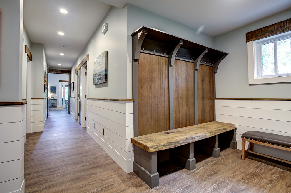Example of a mountain style mudroom design in Grand Rapids with multicolored walls