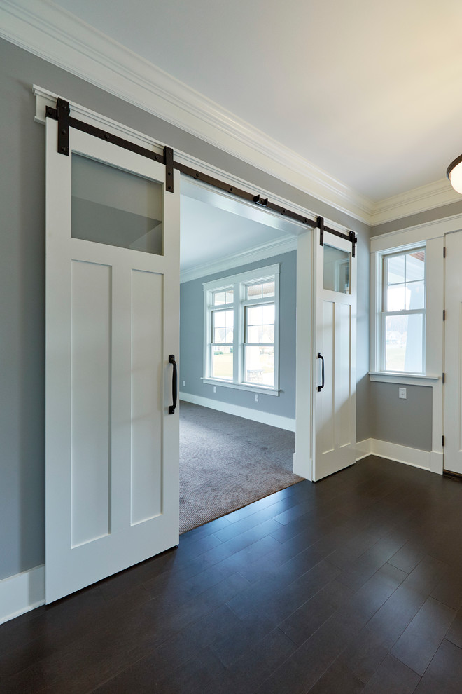 Mid-sized elegant dark wood floor entryway photo in Other with gray walls and a white front door
