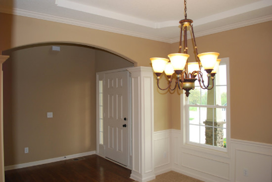Inspiration for a medium sized traditional foyer in Kansas City with beige walls, dark hardwood flooring, a single front door and a white front door.
