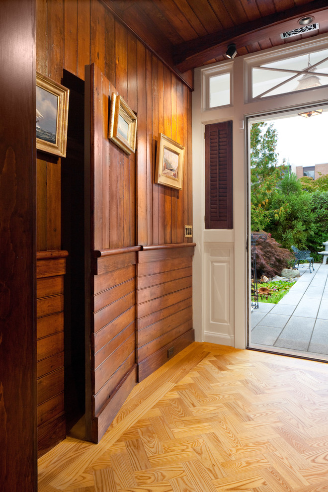 Large eclectic light wood floor vestibule photo in Providence with brown walls