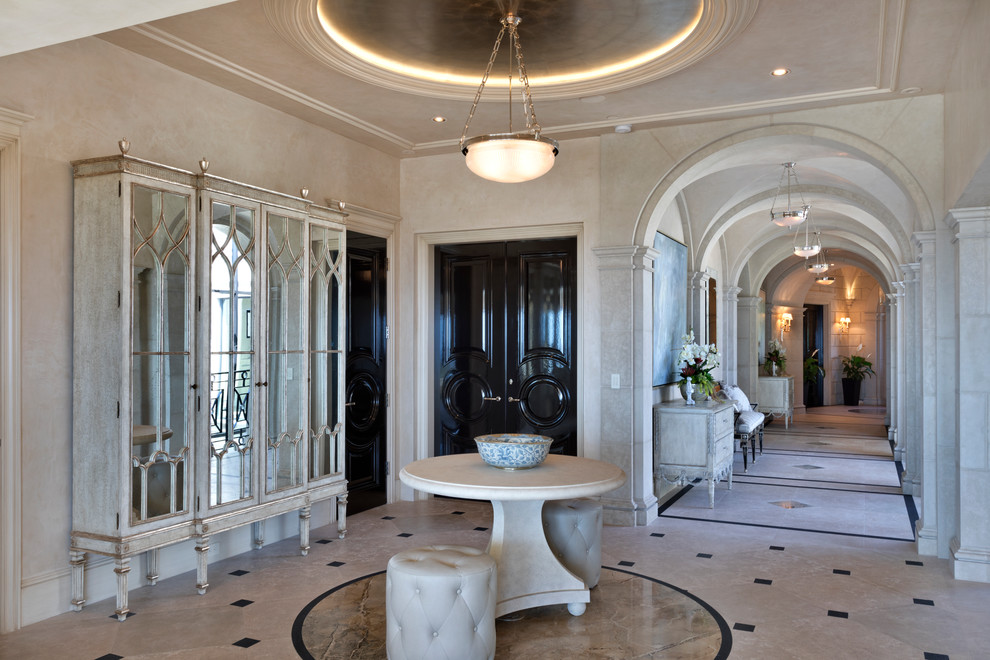 Elegant marble floor foyer photo in Orange County