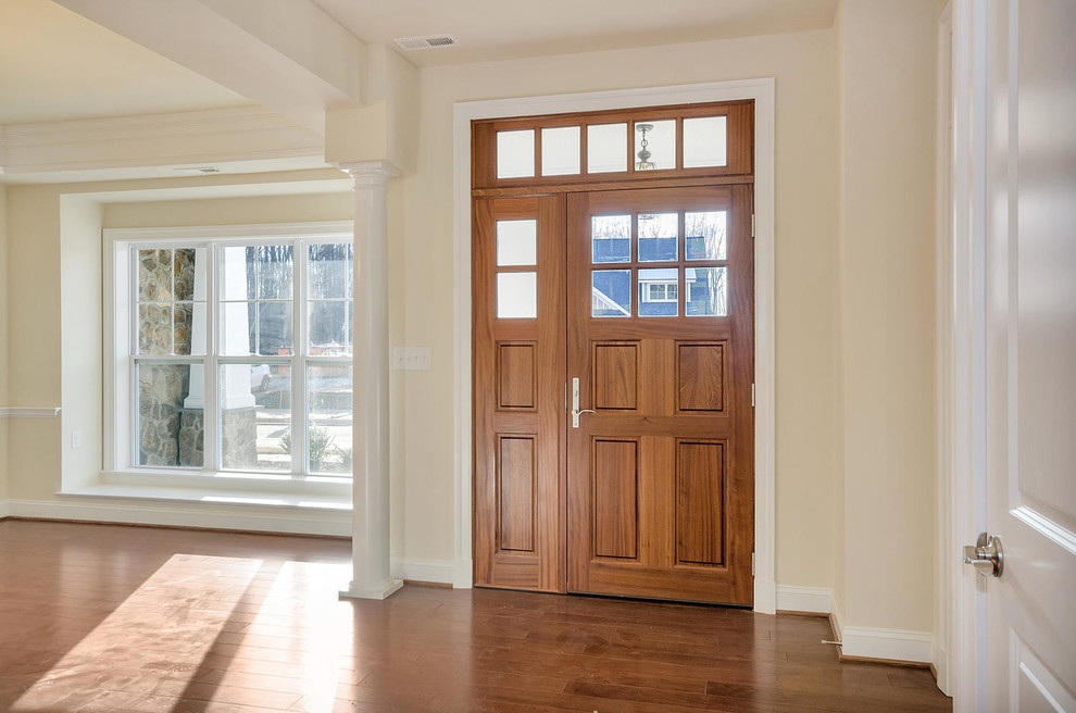 Inspiration for a medium sized traditional front door in Other with a medium wood front door, beige walls, medium hardwood flooring and a single front door.
