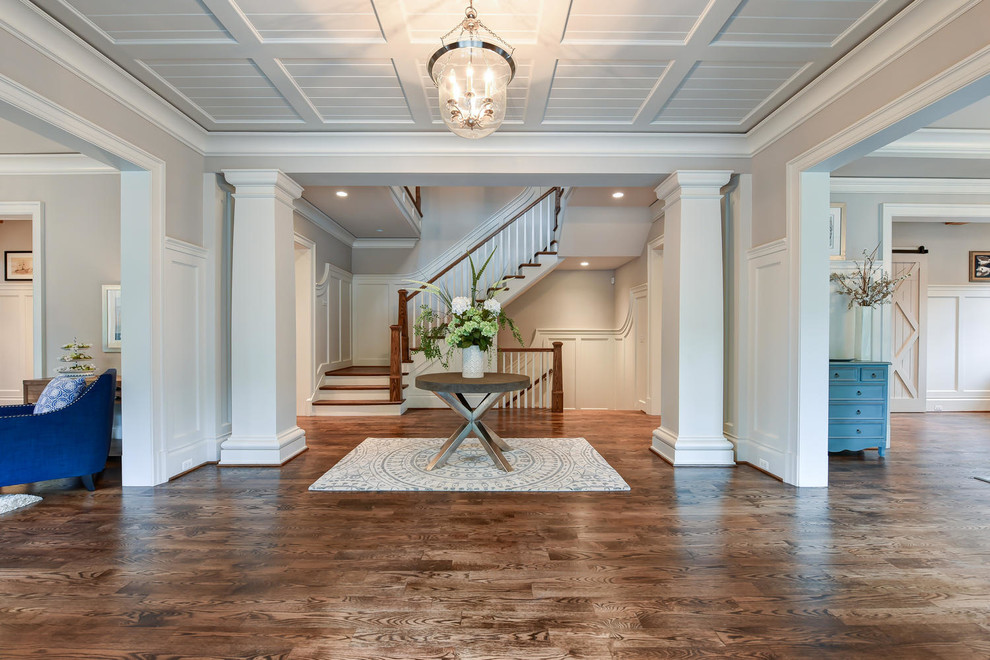 Inspiration for a large traditional foyer in DC Metro with grey walls and a double front door.
