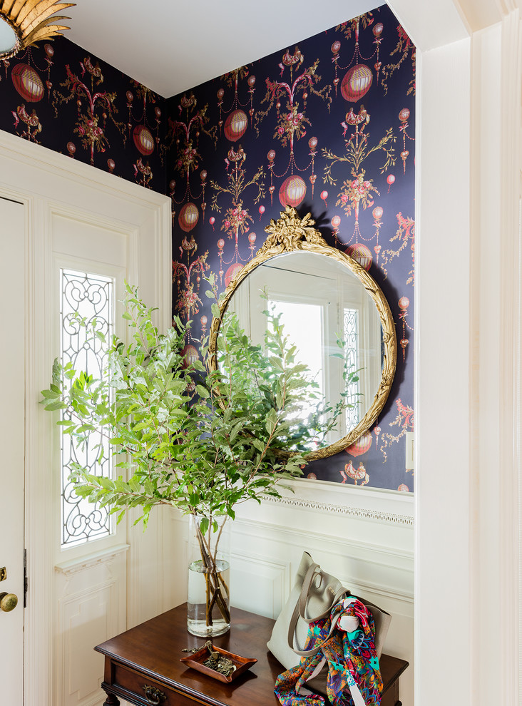Elegant foyer photo in Boston with multicolored walls and a white front door