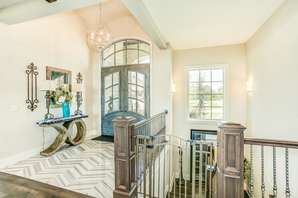 Large classic foyer in Wichita with white walls, porcelain flooring, a double front door and a blue front door.