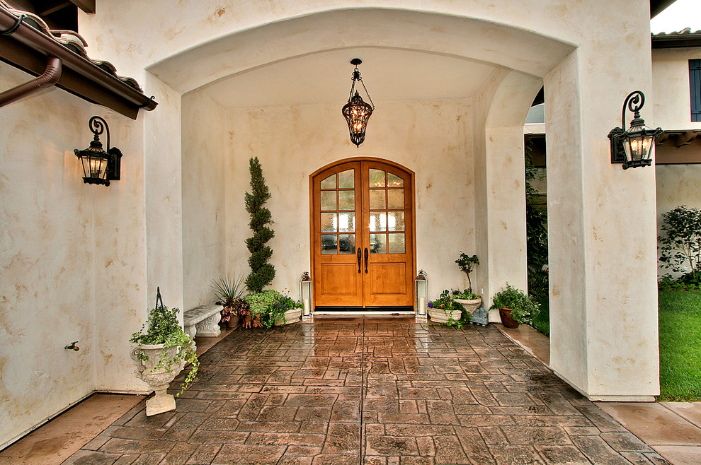 Photo of a mediterranean porch in San Diego with a double front door.