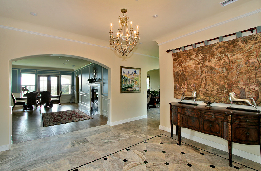 Inspiration for a timeless foyer remodel in San Diego with beige walls