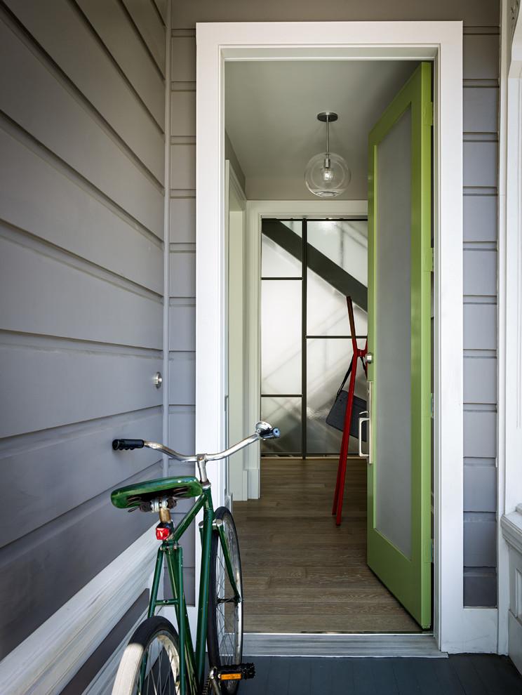 Entryway - transitional entryway idea in San Francisco with a green front door