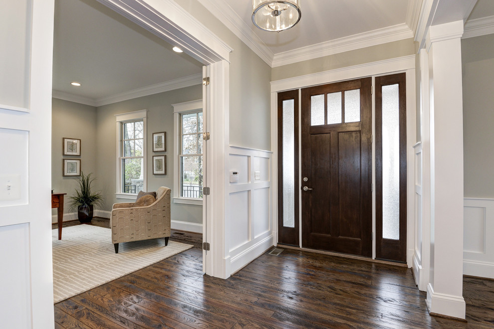 Mid-sized arts and crafts dark wood floor entryway photo in DC Metro with gray walls and a dark wood front door