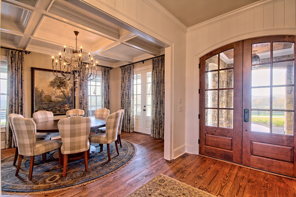 Example of a large mountain style medium tone wood floor dining room design in Atlanta with beige walls