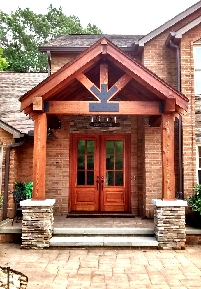 Small rustic front door in Other with granite flooring, a double front door and a medium wood front door.
