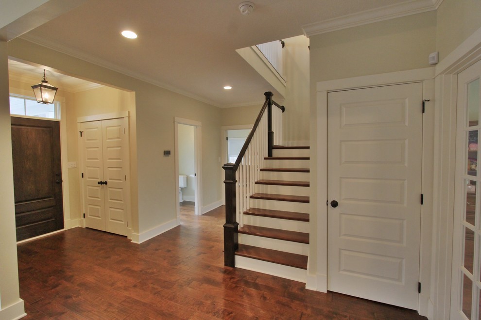 Inspiration for a medium sized farmhouse foyer in Other with yellow walls, medium hardwood flooring, a single front door and a dark wood front door.