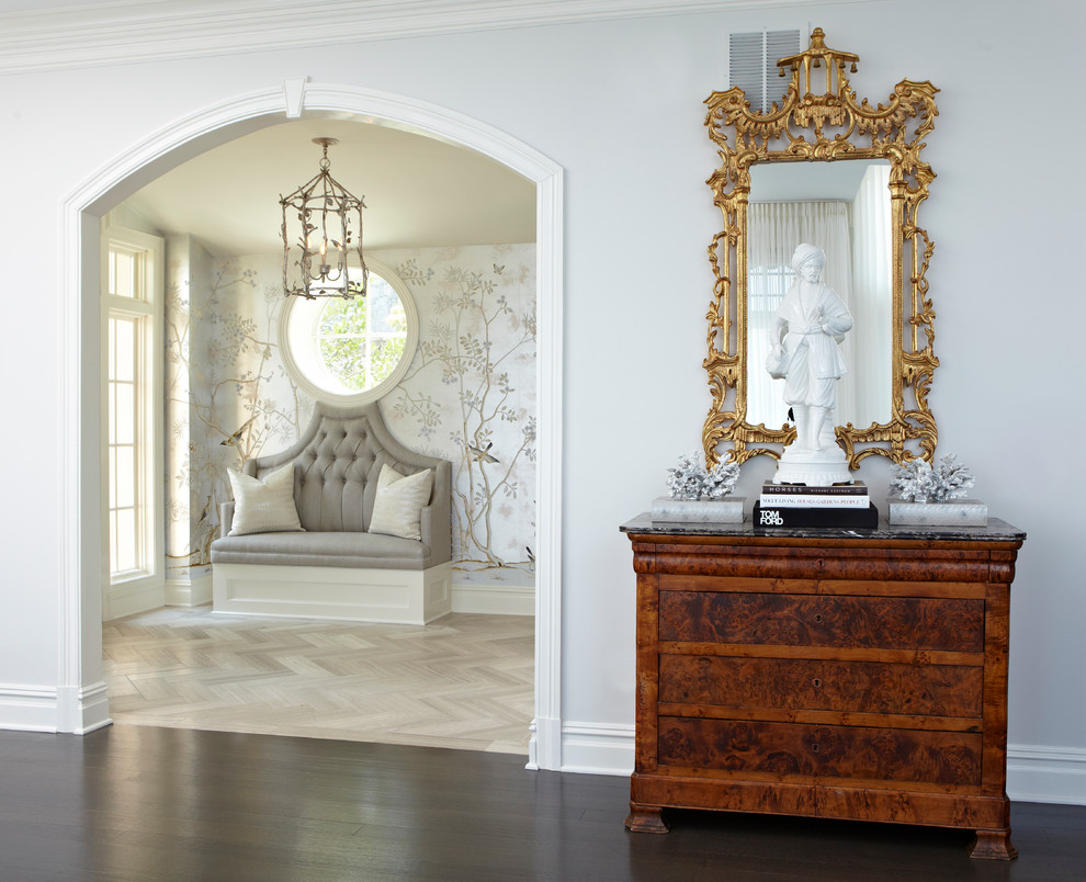 Design ideas for a large classic entrance in New York with light hardwood flooring, grey walls and brown floors.