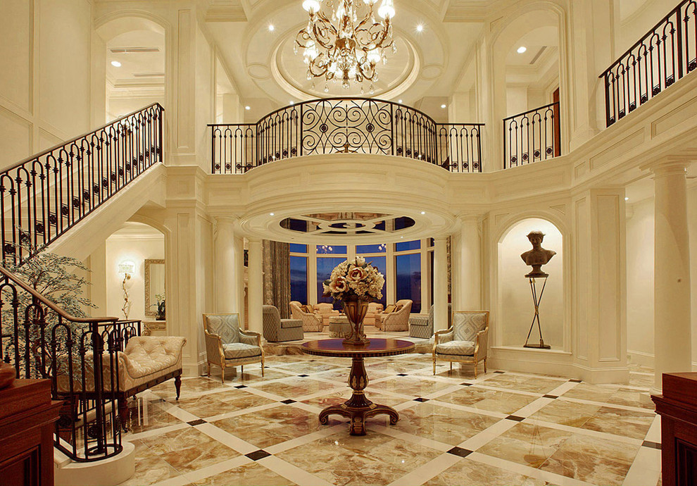 Inspiration for a large timeless marble floor foyer remodel in Miami with white walls