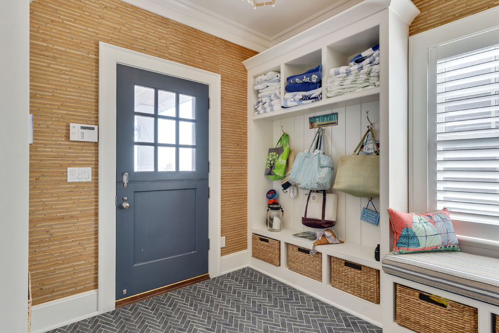 На фото: тамбур в морском стиле с голландской входной дверью, серым полом, разноцветными стенами, полом из керамической плитки и синей входной дверью