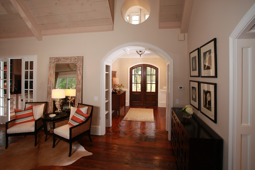 Mid-sized elegant medium tone wood floor entryway photo in Atlanta with beige walls and a medium wood front door