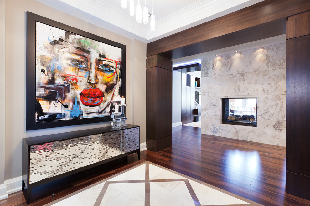 Large contemporary foyer in Toronto with beige walls and medium hardwood flooring.