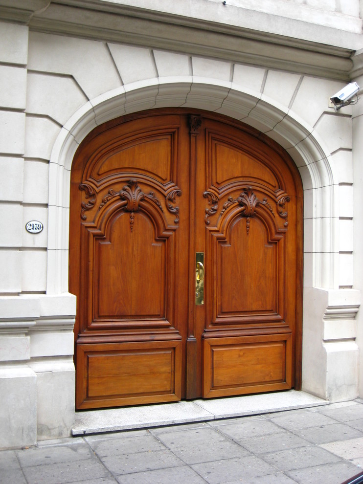 Design ideas for a large midcentury front door in Other with beige walls, a double front door and a medium wood front door.