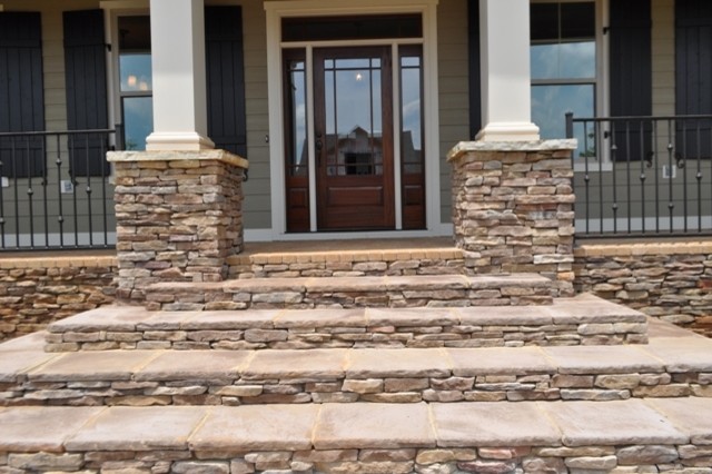 Example of a mid-sized arts and crafts entryway design in Other with a glass front door