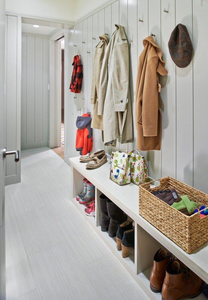 Mid-sized trendy gray floor mudroom photo in New York with gray walls