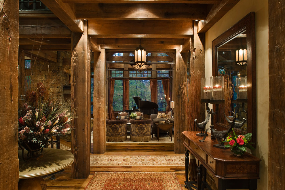 Photo of a rustic foyer in Other with medium hardwood flooring and beige walls.